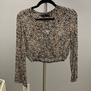 Cropped long sleeve V neck top